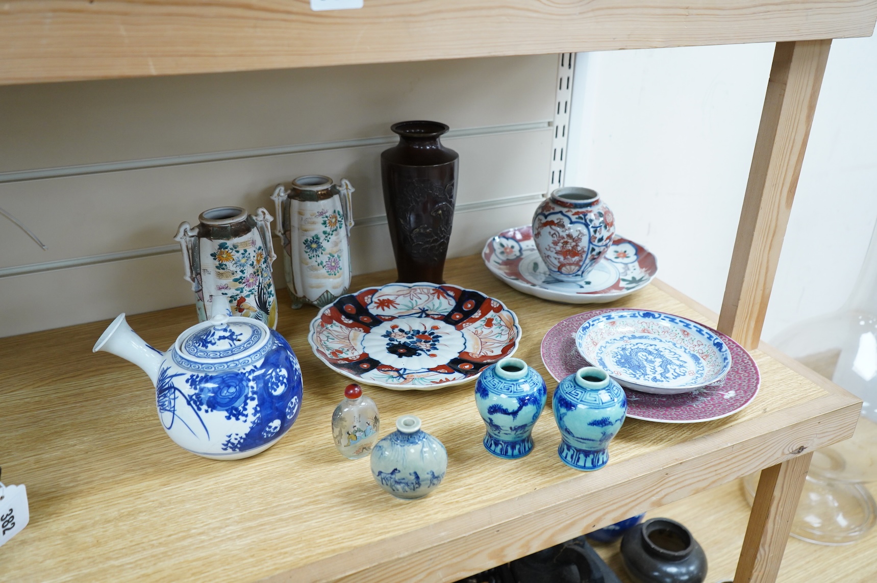 A collection of Asian ceramics to include an inside painted glass snuff bottle, pink ground dish and an Imari dish